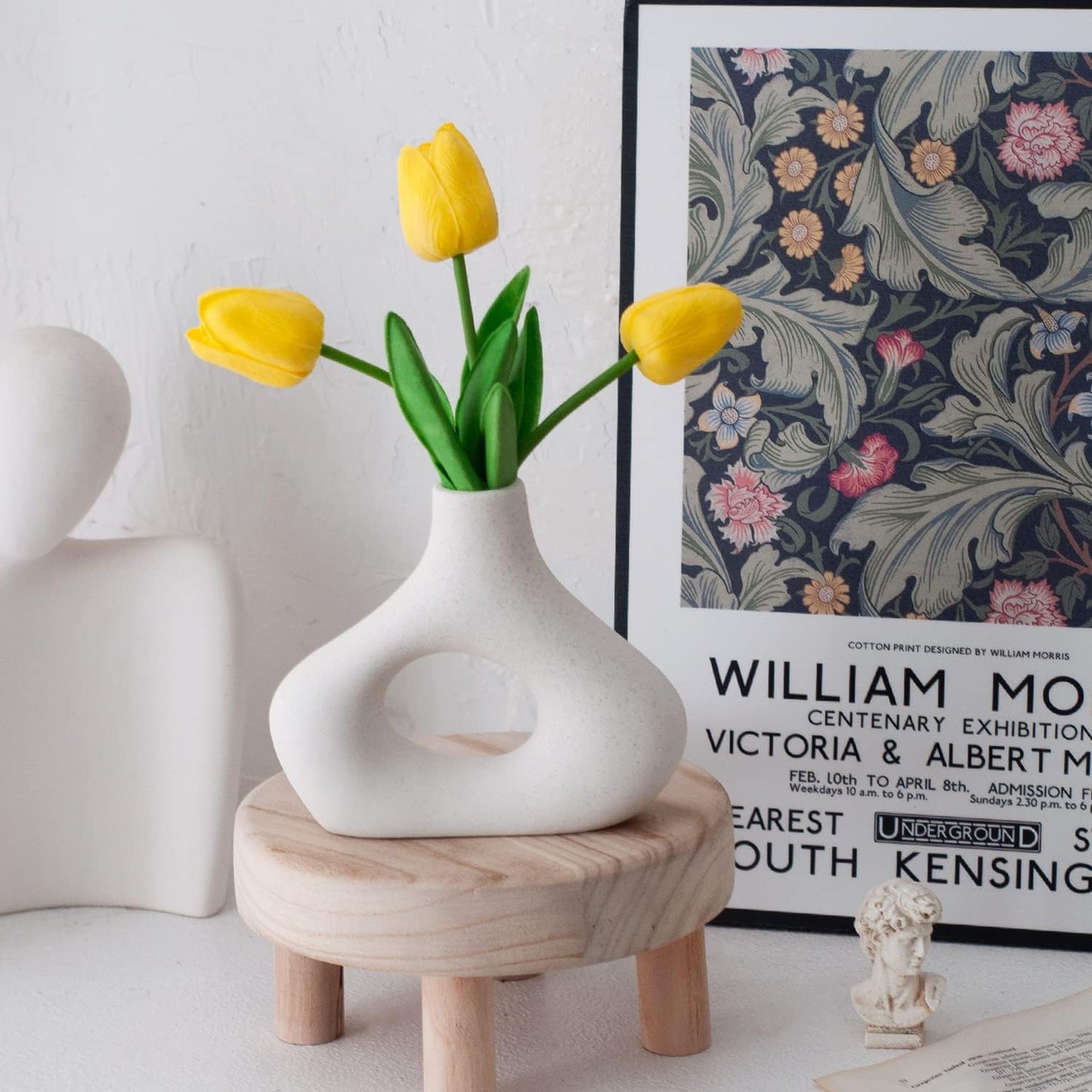 Modern white ceramic vase with yellow tulips, perfect for home decor and stylish centerpieces.