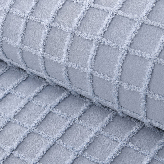 Textured blue cotton fabric in a grid pattern, perfect for quilt cover sets or home decor accents.