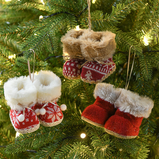 Set of 3 knitted Christmas boot ornaments with faux fur trim hanging on a Christmas tree, perfect for festive decorations.