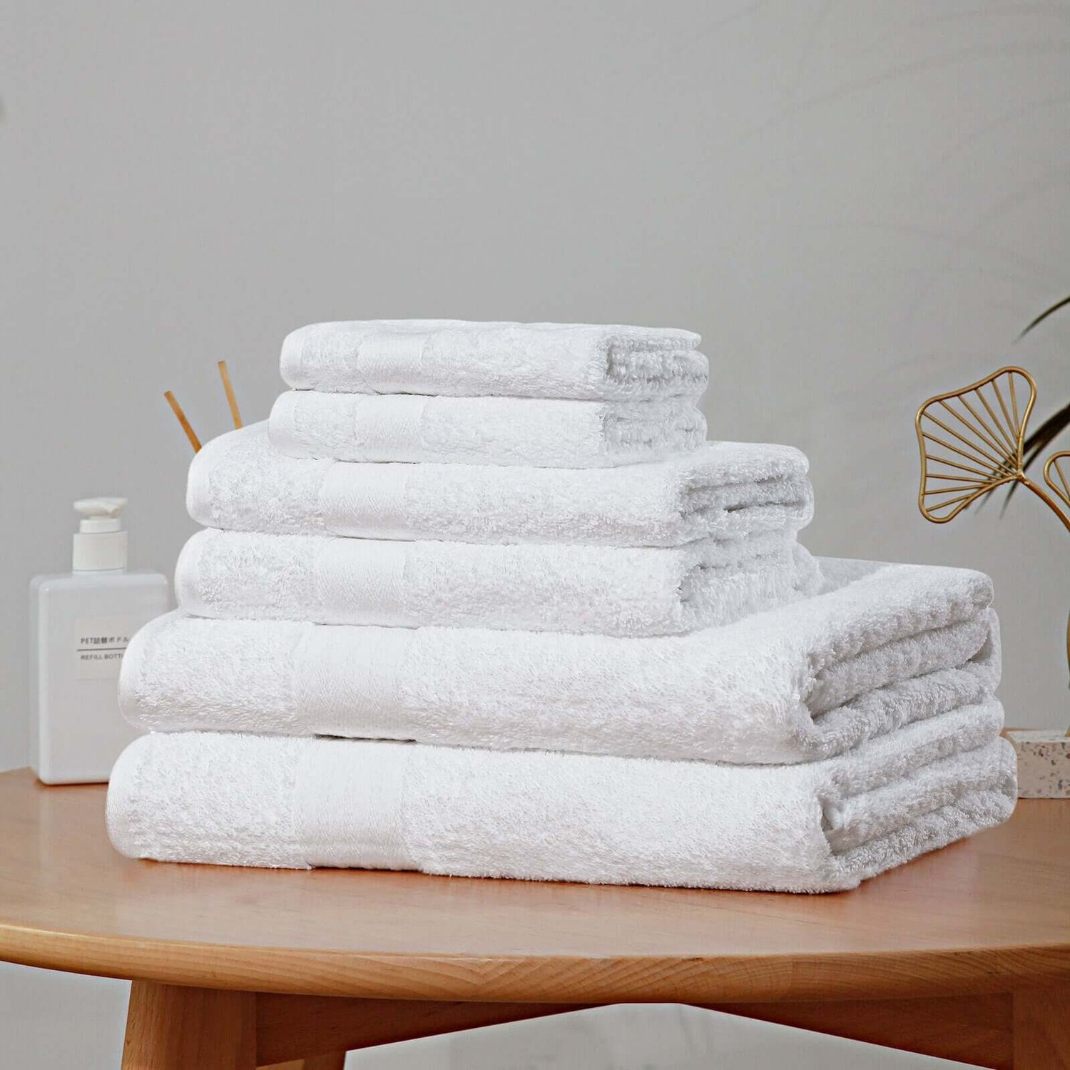 Collection of high-quality bath towels in various colors and textures, designed for maximum absorbency and comfort in any bathroom setting.