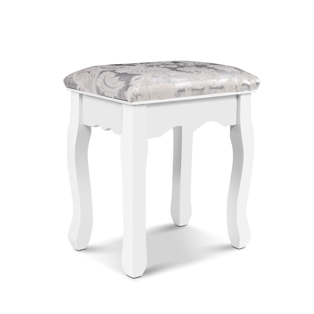 Elegant white dressing table stool with a plush, floral cushion, perfect for vanities and adding charm to any bedroom.