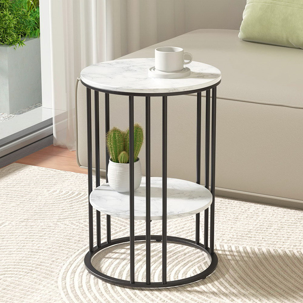 Sleek round coffee table with marble effect top, featuring two tiers, metal frame, and minimalistic design for modern living spaces.