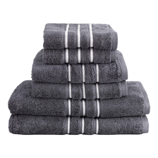 Luxury grey cotton bath towels set stacked showcasing plush texture and elegant design for a stylish bathroom.