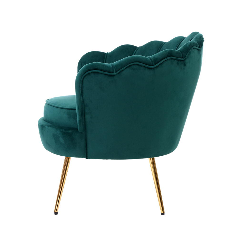 Elegant green velvet accent chair with scalloped design and gold legs, adding a stylish colour pop to any room.