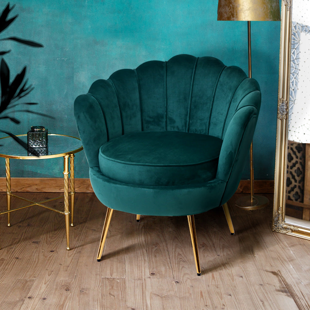 Luxurious green velvet accent chair with modern design, adding a stylish colour pop to any living space.