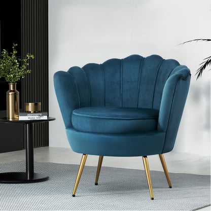 Elegant blue velvet accent chair with a stylish design and gold legs, perfect for adding a luxurious colour pop to any room.