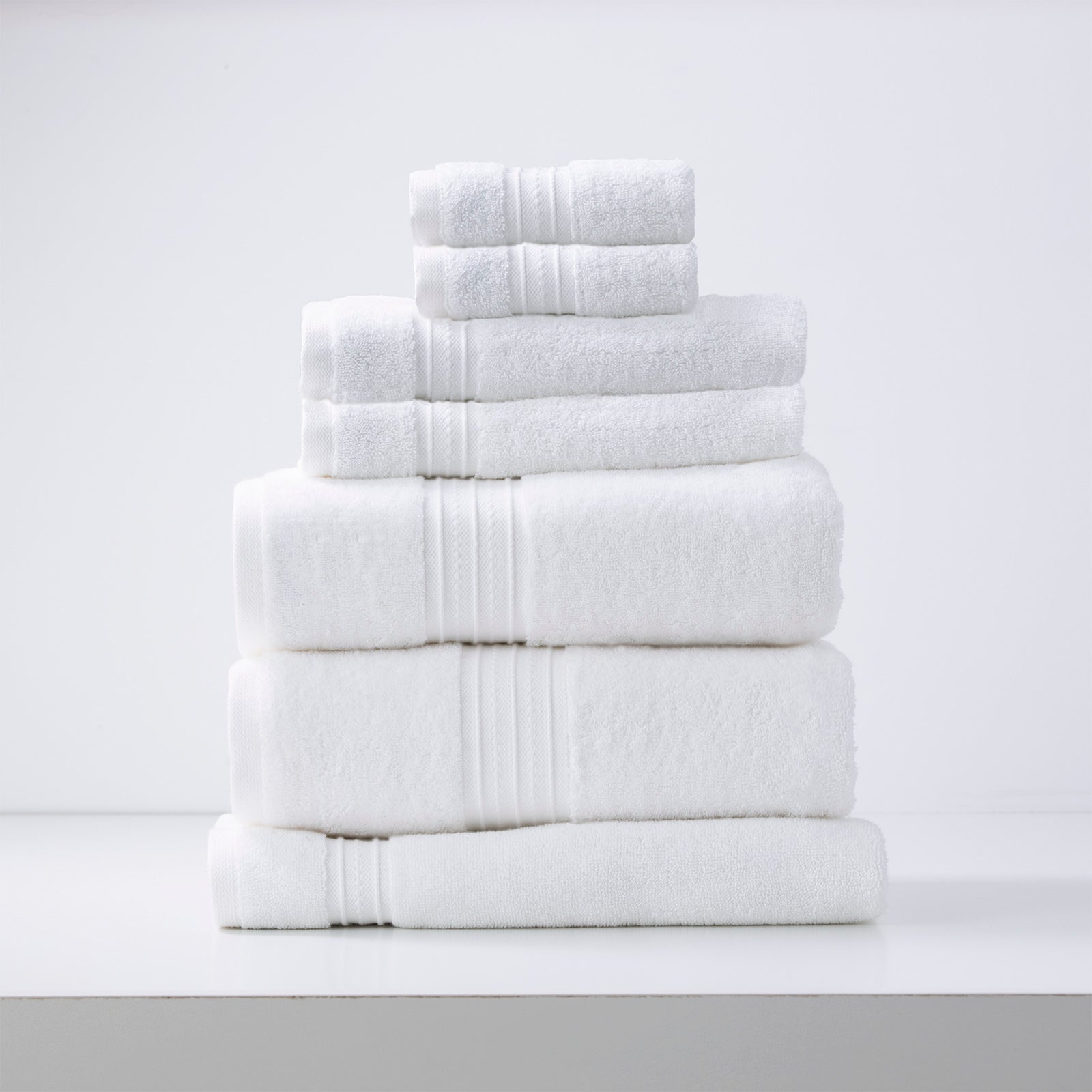 Luxury white bath towels set by Renee Taylor, Brentwood 650 GSM low twist cotton, 7 piece bathroom towels collection for quick drying.