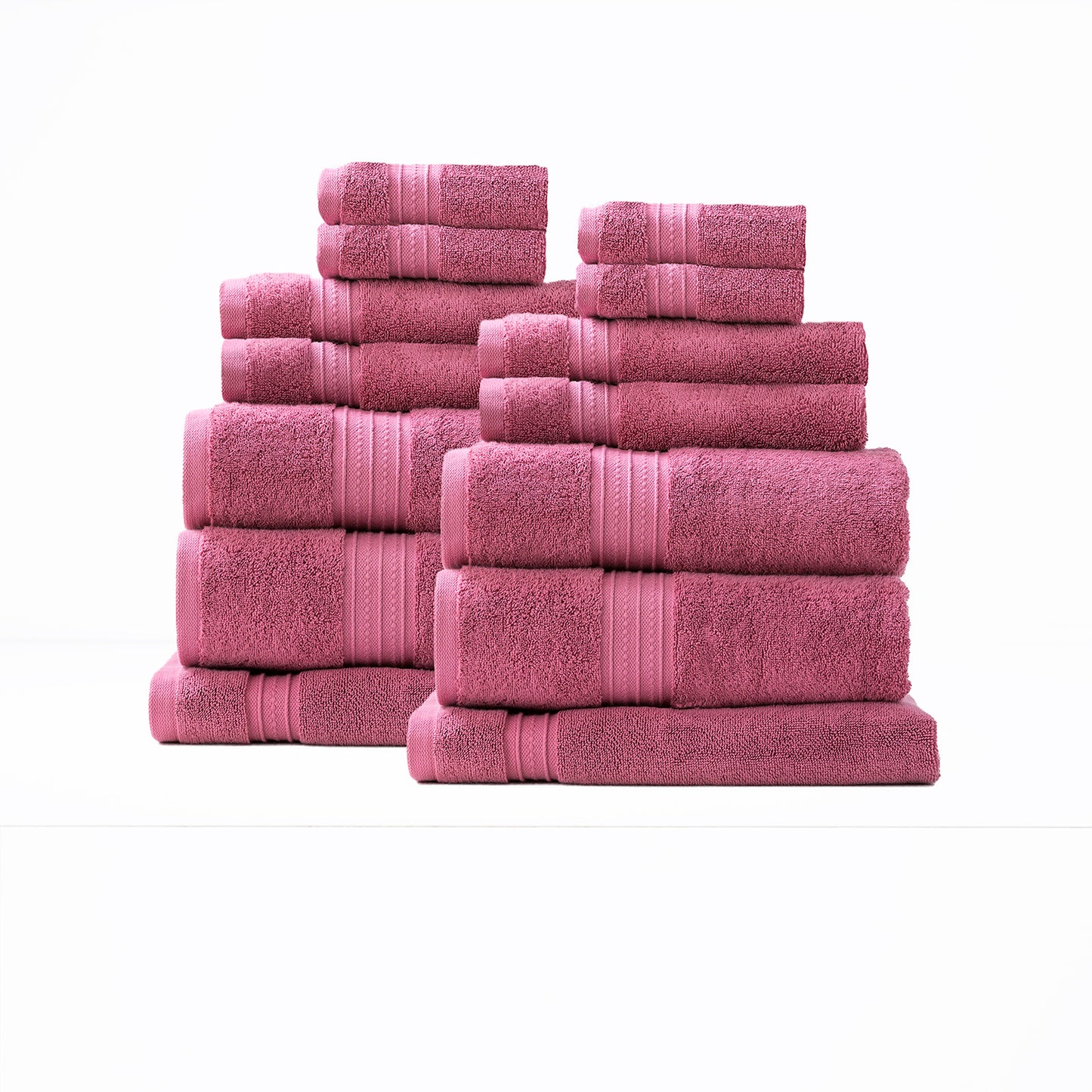 Luxury pink 14-piece bath towels set made of low-twist combed cotton by Renee Taylor, perfect for quick-drying softness in bathrooms.