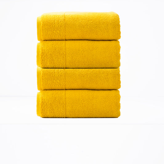 Luxurious spice-colored 650 GSM zero twist bath towel set, 4 pieces by Renee Taylor, offering soft, quick-drying bathroom towels.