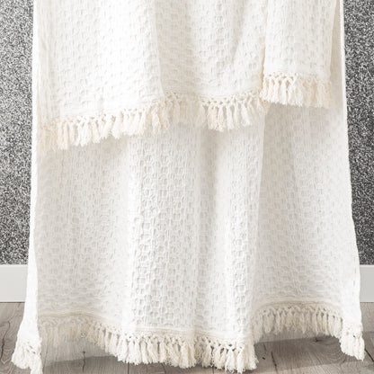 Alysian White Throw blanket by Renee Taylor with crochet fringe detail, made of 100% natural cotton for a soft feel.