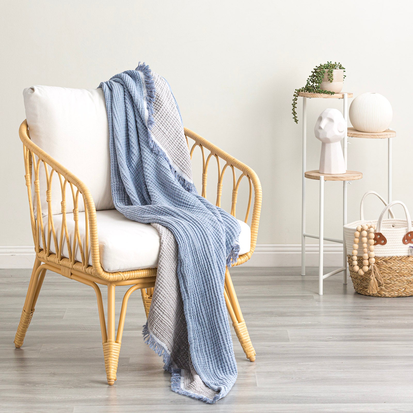 cozy vintage washed cotton throw blanket draped over a stylish chair, adding elegance to home decor.