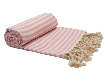 Portsea Turkish Cotton Beach Towel in blush with striped design and tassels, perfect for summer beach outings.