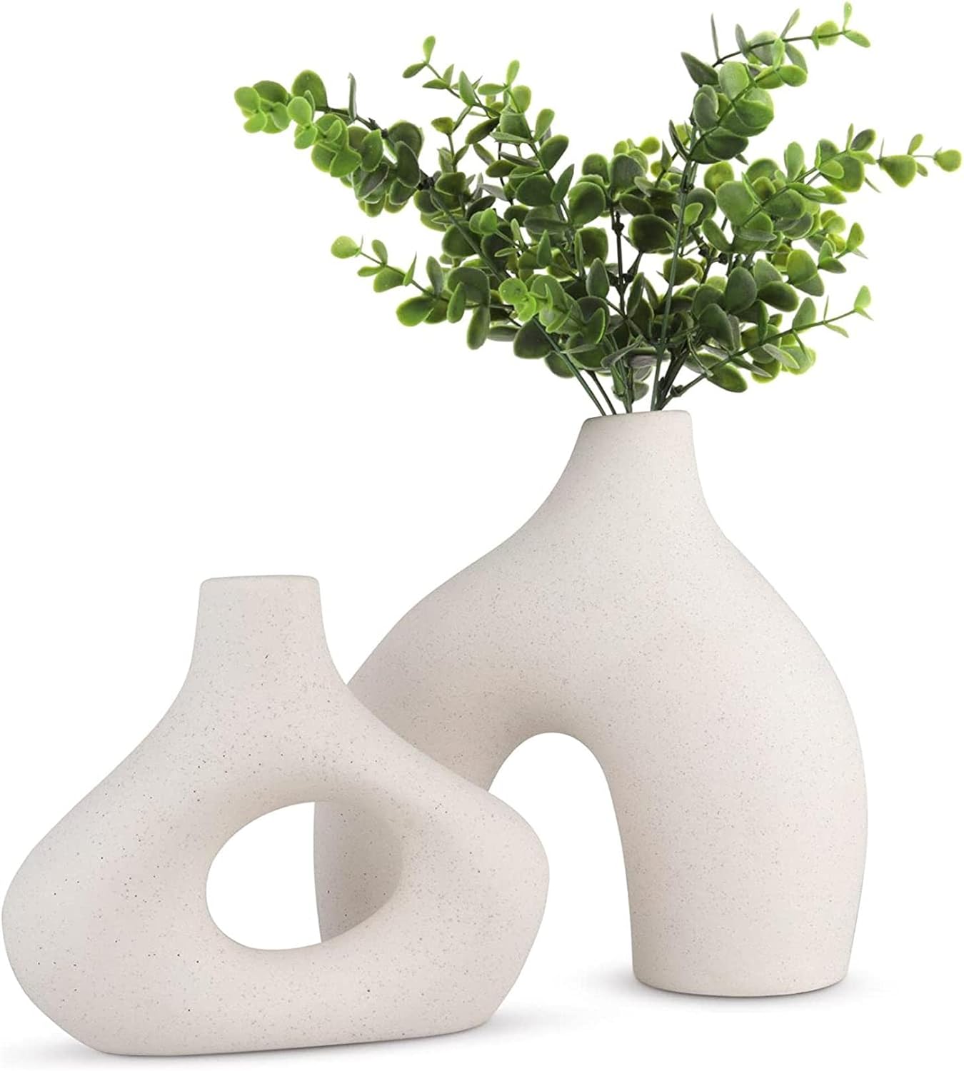 Modern white ceramic vase set with greenery, perfect for stylish home decor and floral arrangements.