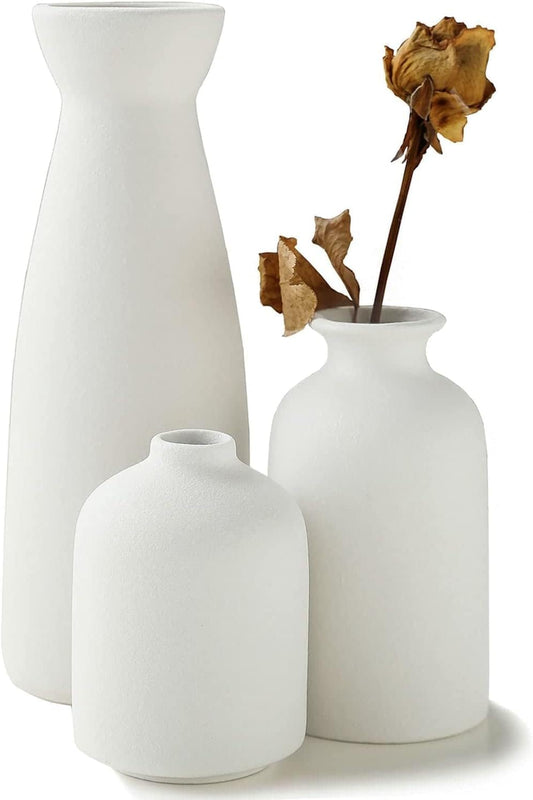 Set of 3 modern matte white ceramic vases with a dried flower, perfect for minimalist home decor and elegant flower displays.