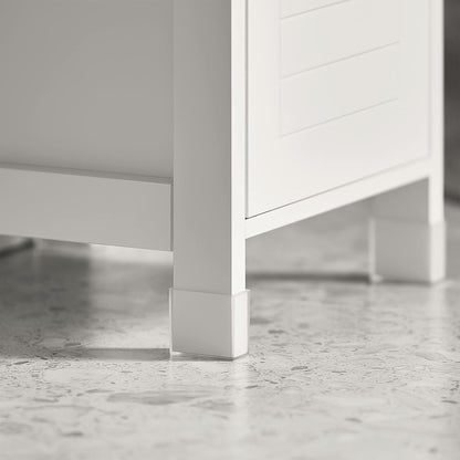 Close-up of the leg of a stylish white freestanding cabinet on a polished floor, highlighting its modern design.