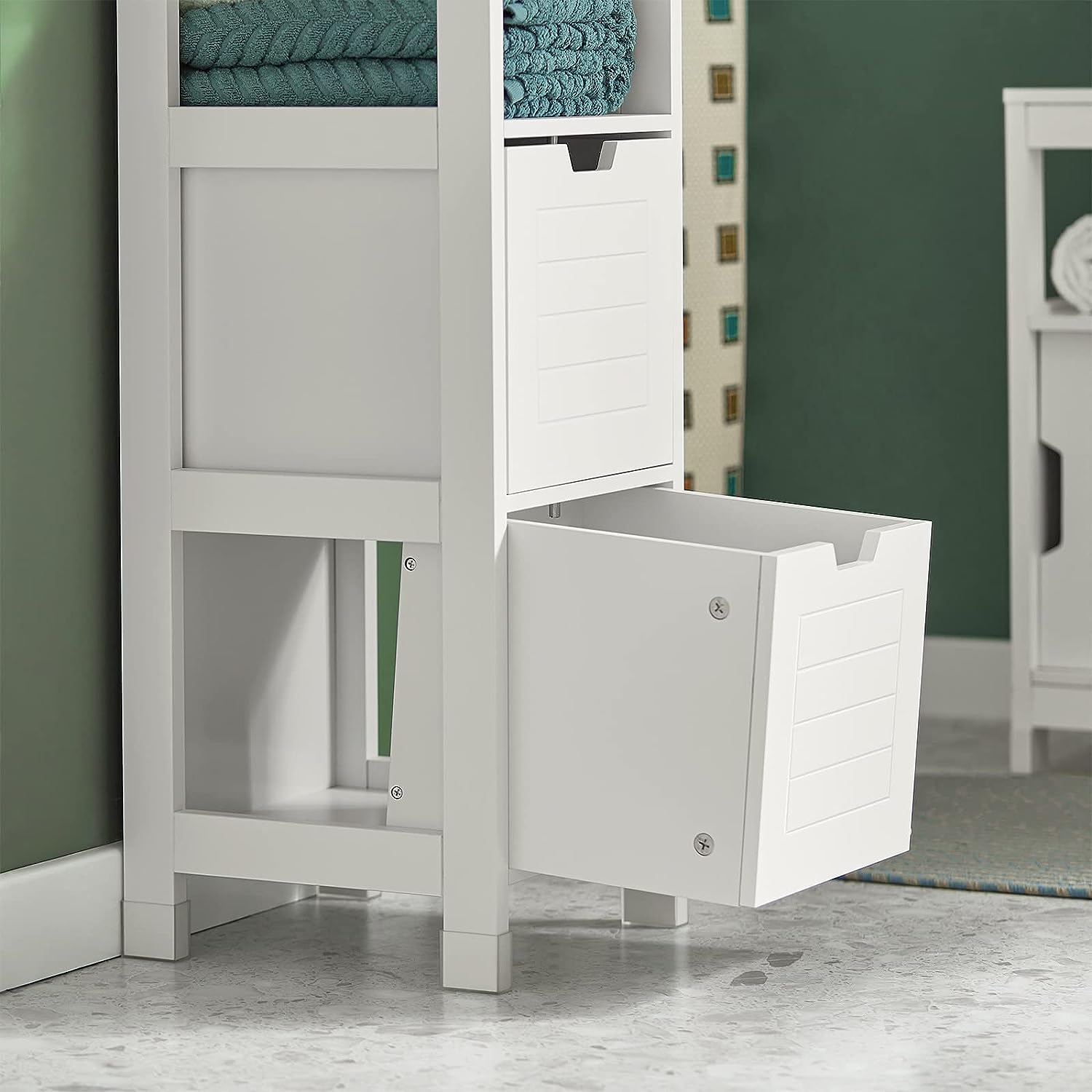 Freestanding white cabinet with two drawers and open shelf for stylish storage and organization in a home.