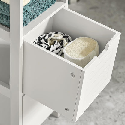 Freestanding cabinet drawer with neatly folded towels and storage baskets for organized living spaces.