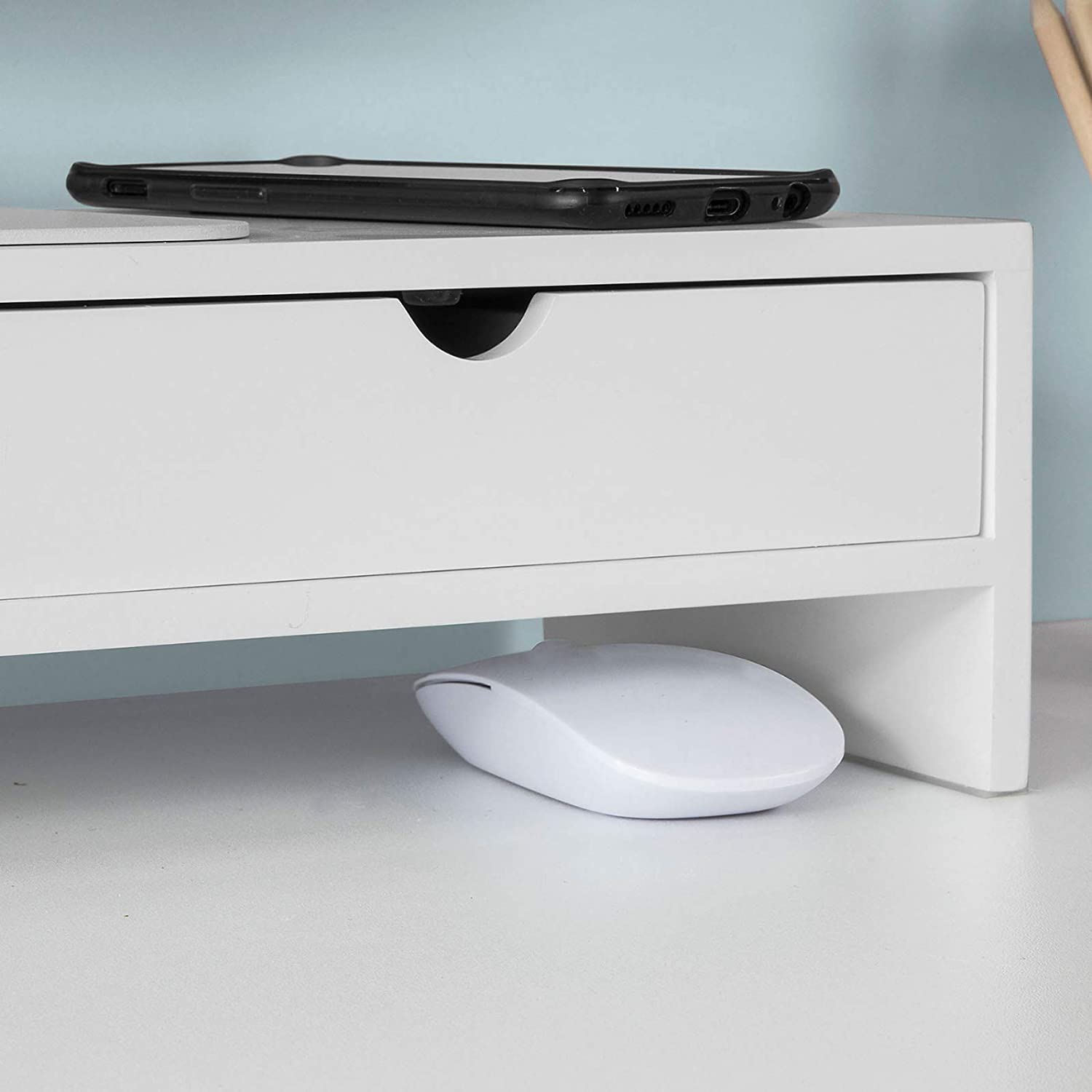 White monitor stand desk organizer with drawer and mouse, perfect for enhancing workspace and reducing clutter.