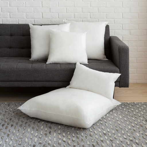 Soft polyester cushion inserts arranged on a couch, ideal for home decor and comfort. Perfect for sofa and couch cushions.