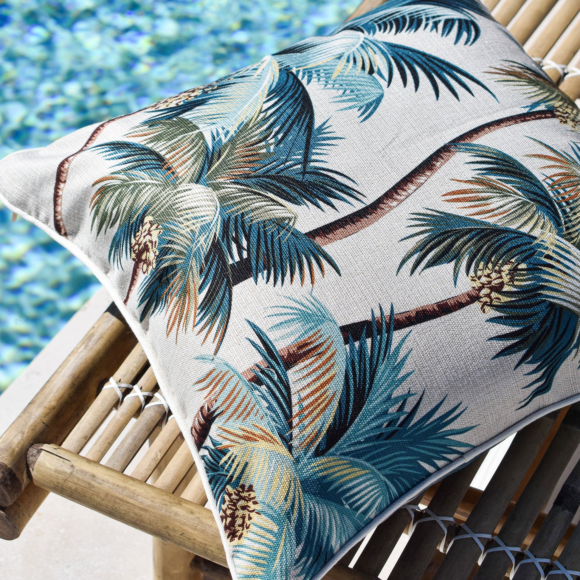 Cushion cover with palm tree design, perfect for indoor or outdoor use, enhancing tropical decor in sofa or couch settings.