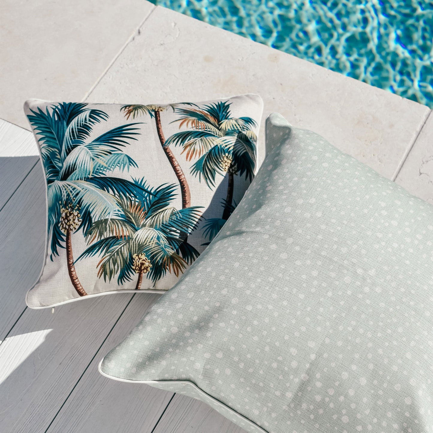 Decorative cushion covers featuring palm trees, perfect for indoor or outdoor tropical decor.