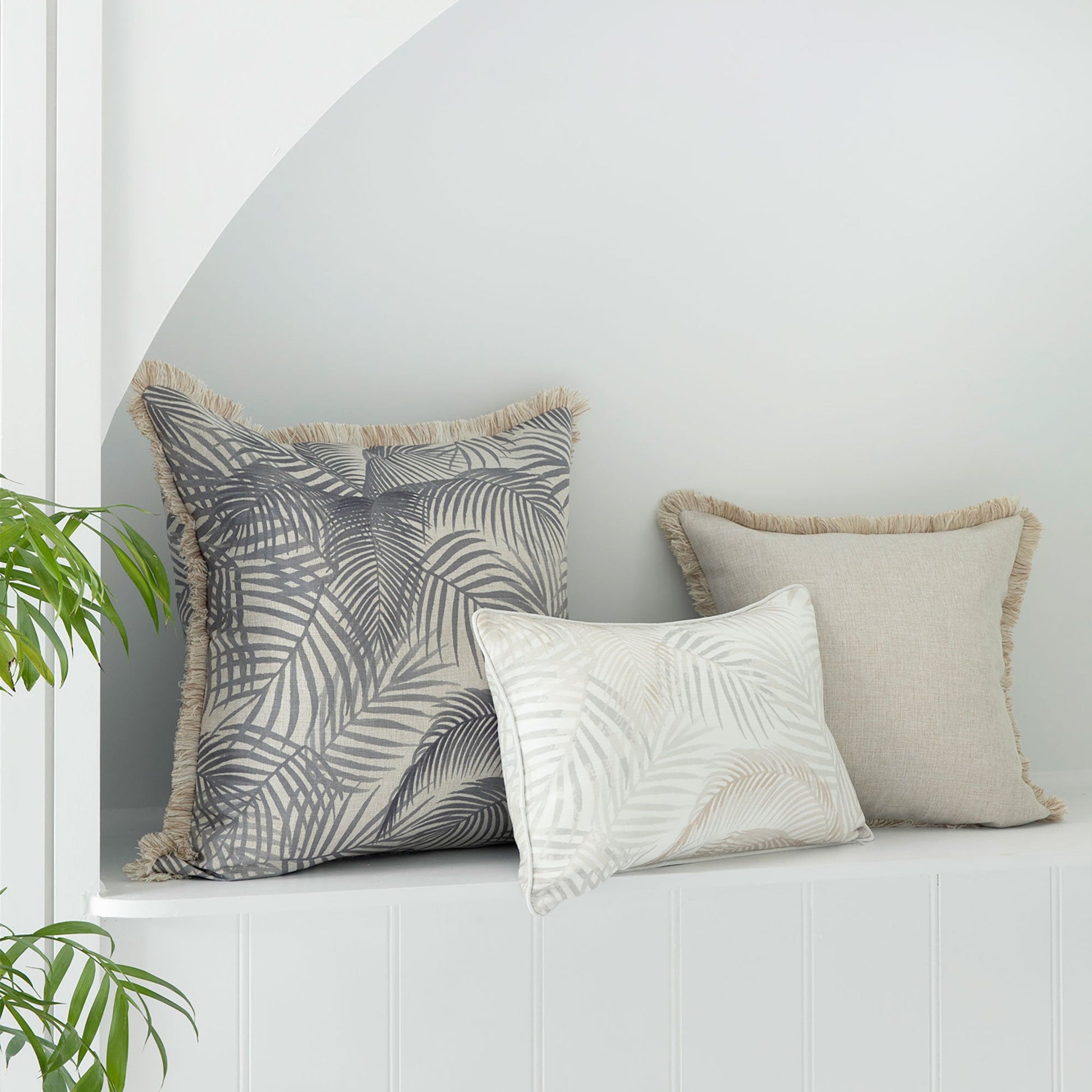 Three decorative cushion covers with tropical fringing, perfect for enhancing any couch or sofa decor.