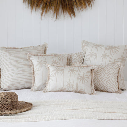 Tropical themed cushion covers in soft beige tones, perfect for sofas and couch decor.