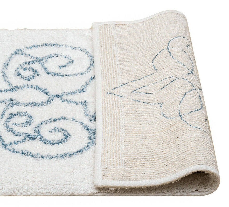 Cotton medallion tufted bath mat with jacquard design, perfect for stylish bathroom comfort.