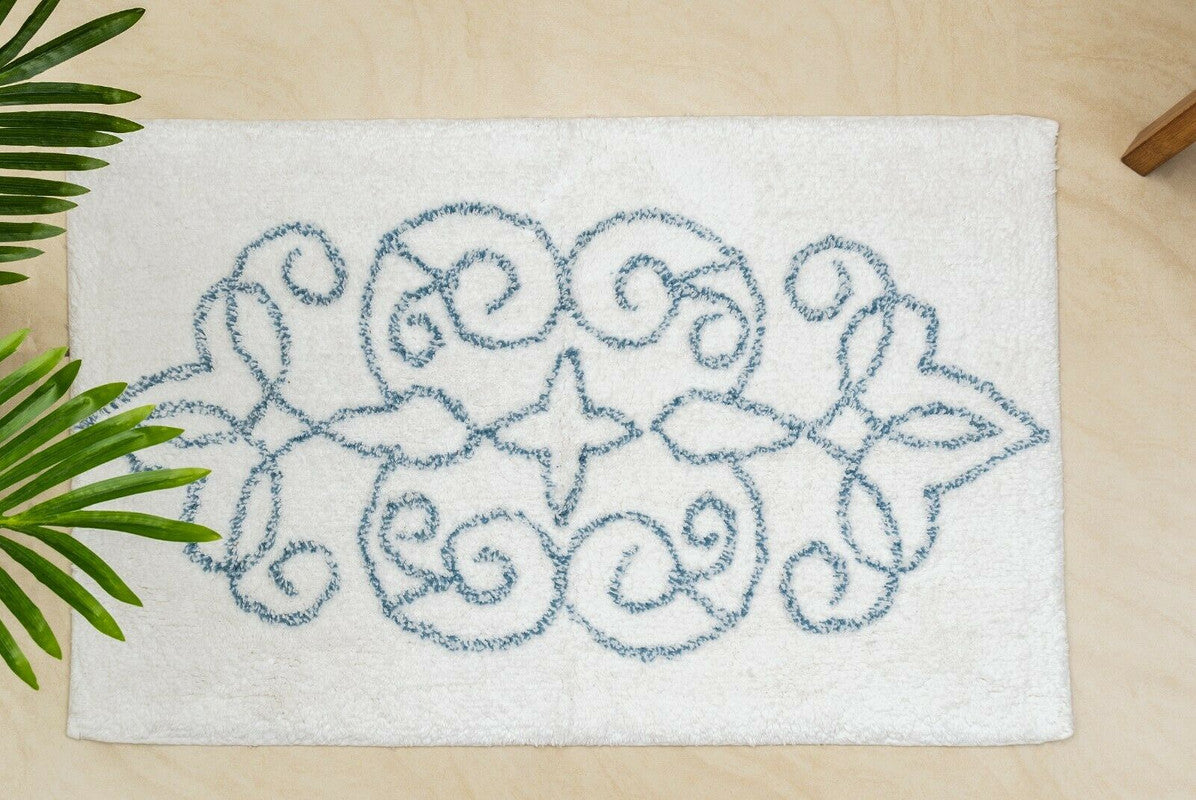 Cotton medallion tufted bath mat with blue jacquard design, perfect for stylish bathroom comfort.