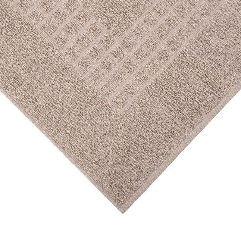 Taupe microfiber bath mat with a check design, ideal for enhancing comfort and style in any bathroom.