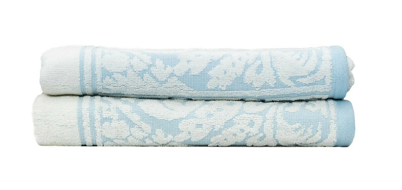 Premium cotton bath towels in jacquard white and blue design, soft and absorbent for a luxurious bathroom experience.