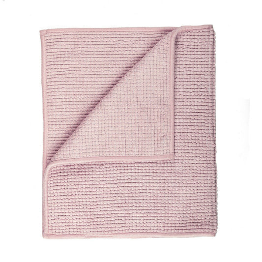 Soft pink microfiber bath mat with non-slip design, perfect for adding warmth to your bathroom. Ideal bath mats for bathroom use.