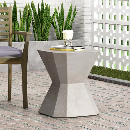 Tablua large grey round coffee table with soft curves and smooth tabletop on a pedestal base