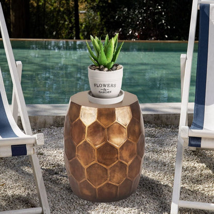 Tablua Australia round side table placed in an outdoor setting next to a rattan chair by the pool