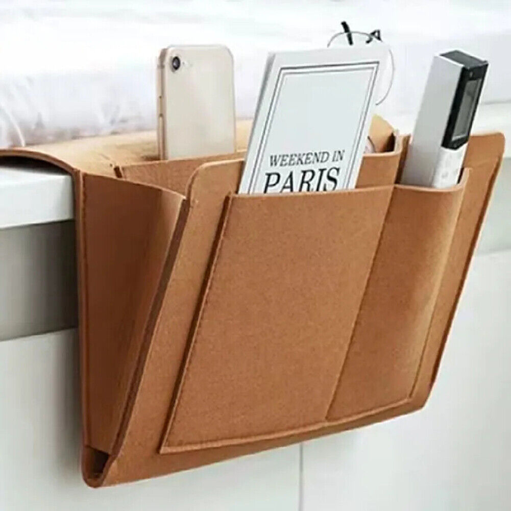 Khaki sofa organiser for convenient storage of books and remotes on a living room sofa