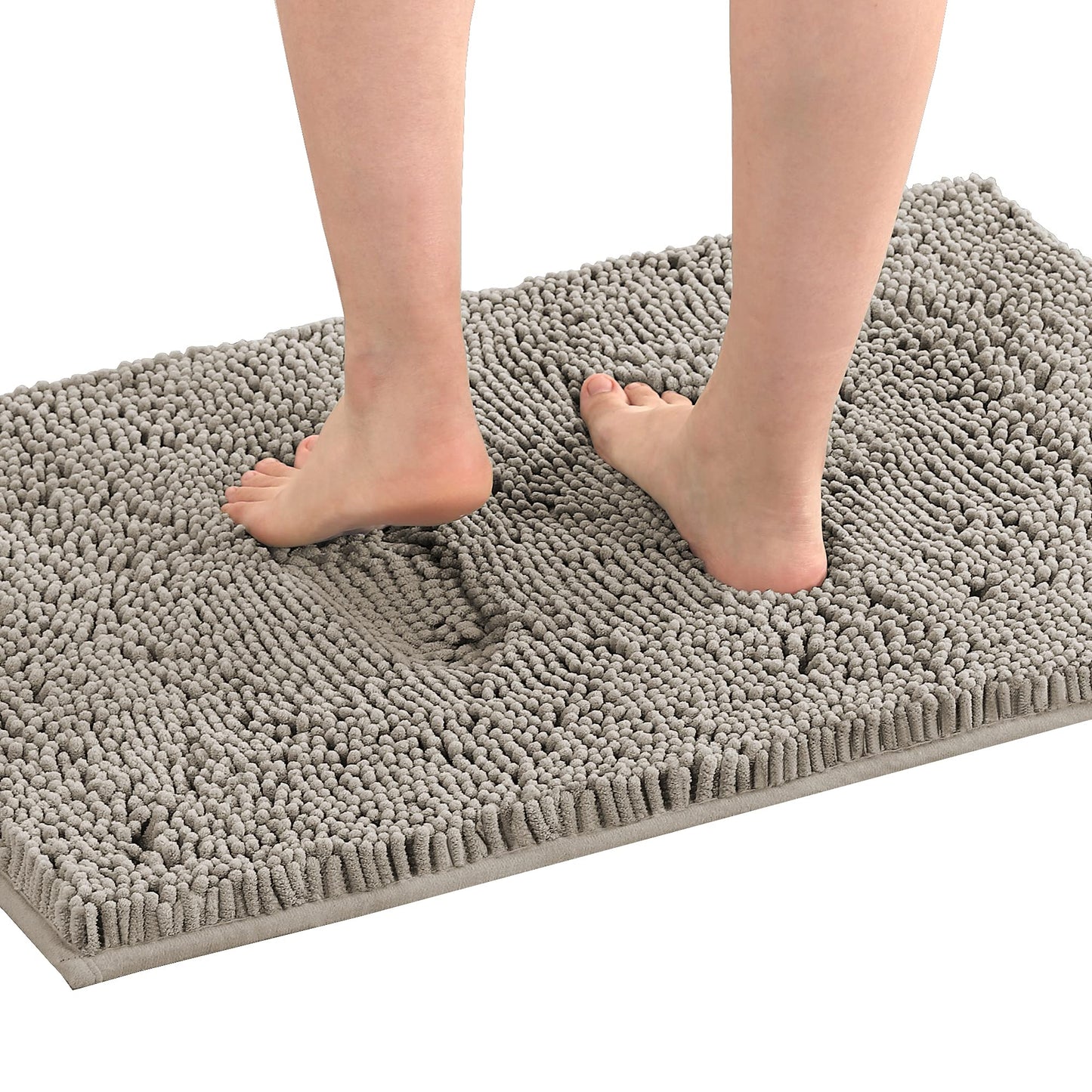 Feet on a grey extra soft absorbent non-slip bath mat in a bathroom setting, showcasing comfort and plush texture.