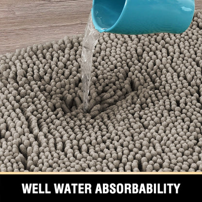 Extra soft grey bath mat showcasing excellent water absorbency with water pouring from a cup. Ideal for bathroom comfort.