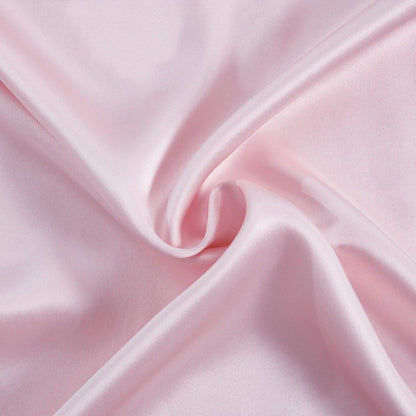 close-up of luxurious pink mulberry silk fabric, perfect for silk pillowcases, offering luxury and comfort.