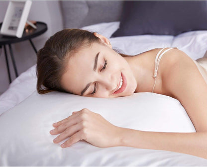 Woman enjoying a restful sleep on a luxury Mulberry silk pillowcase, showcasing comfort and elegance.