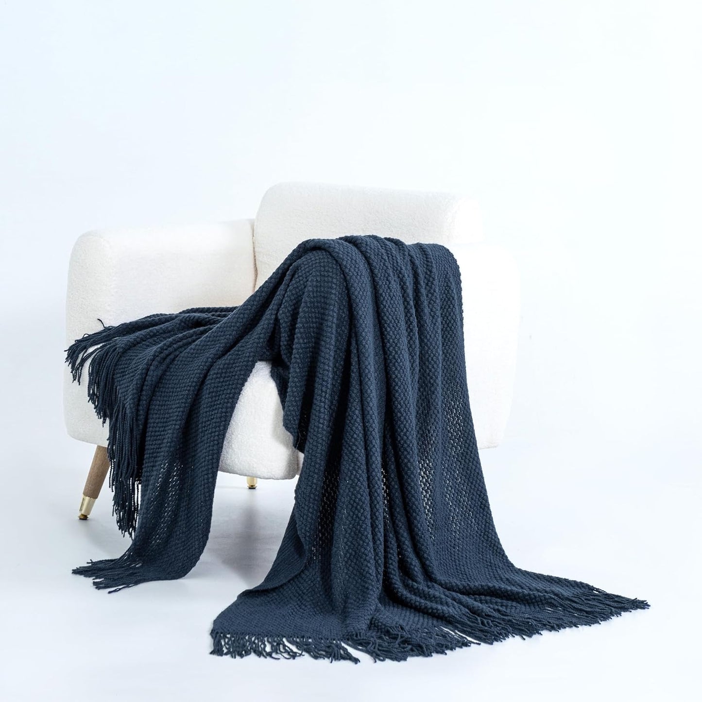 Navy Micro Plush Knitted Woven Throw Blanket on Chair, Ultra-Soft Acrylic Throws for Couch or Bed, Elegant and Cozy Home Decor.