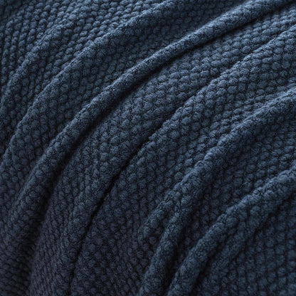 Navy micro plush knitted woven throw blanket detail showcasing ultra-soft texture and luxurious design. Perfect for elegant throws and blankets.