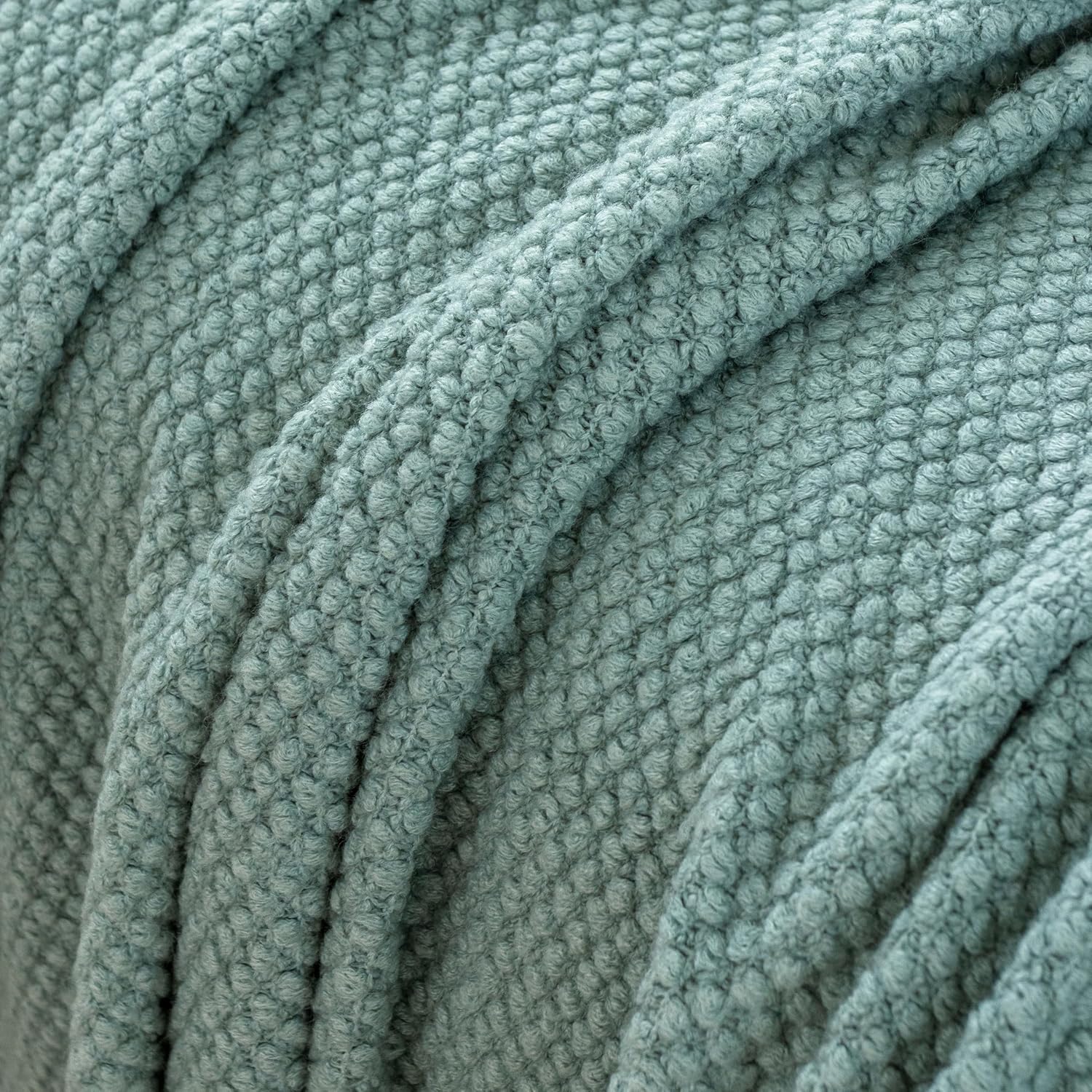 Seafoam micro plush knitted woven throw blanket, soft and cozy acrylic fabric, perfect throw for couch or bed.