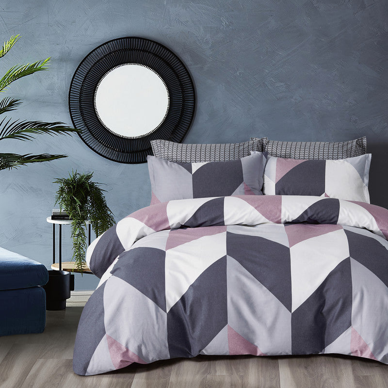 Stylish reversible quilt cover set in geometric design, featuring 100% cotton, perfect for a modern queen-size bed.