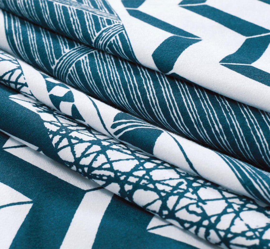 Close-up of the Jasper microfiber quilt cover set featuring intricate teal and white patterns, perfect for stylish bedroom décor.