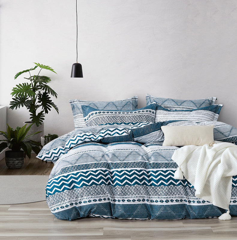 Elegant Jasper microfiber reversible quilt cover set in teal and white, featuring quilt cover and pillowcases in a stylish bedroom setting.