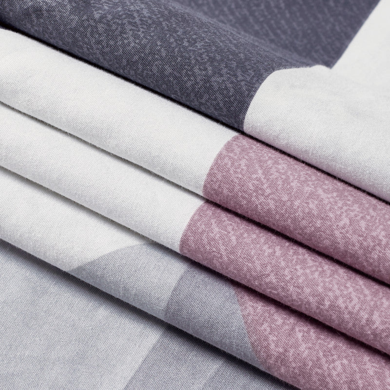 Close-up of Dylan cotton quilt cover set showing reversible design in grey, white, and pink colors, perfect for stylish bedding.