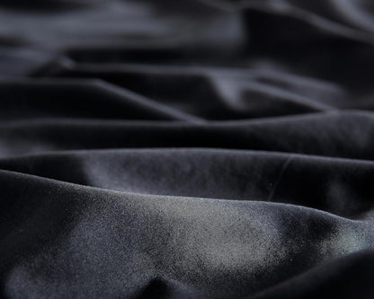 Luxurious black microfibre fabric showcasing a vintage washed texture, ideal for stylish pillowcases.