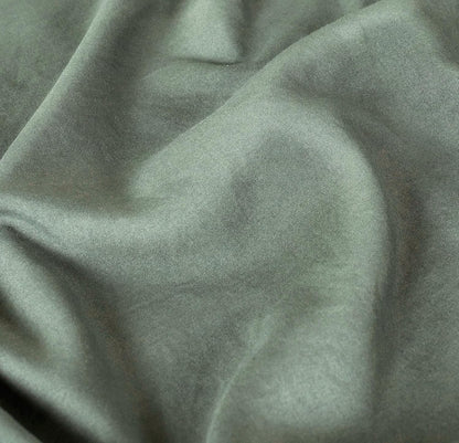 Luxurious khaki green microfibre fabric with a vintage washed texture, perfect for elegant pillowcases.