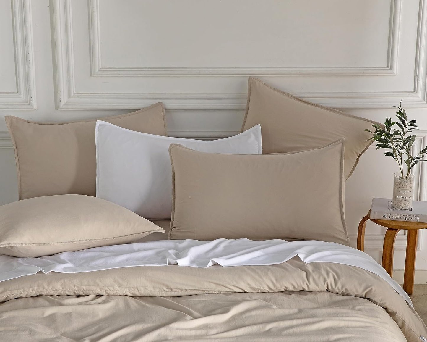 Luxurious vintage washed microfibre pillowcases in soft neutral tones, enhancing a cozy European-style bedding setup.