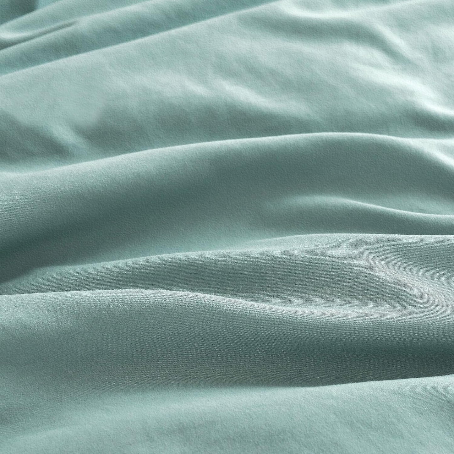 Luxurious seafoam microfibre fabric showcasing the soft texture of vintage washed pillowcases.